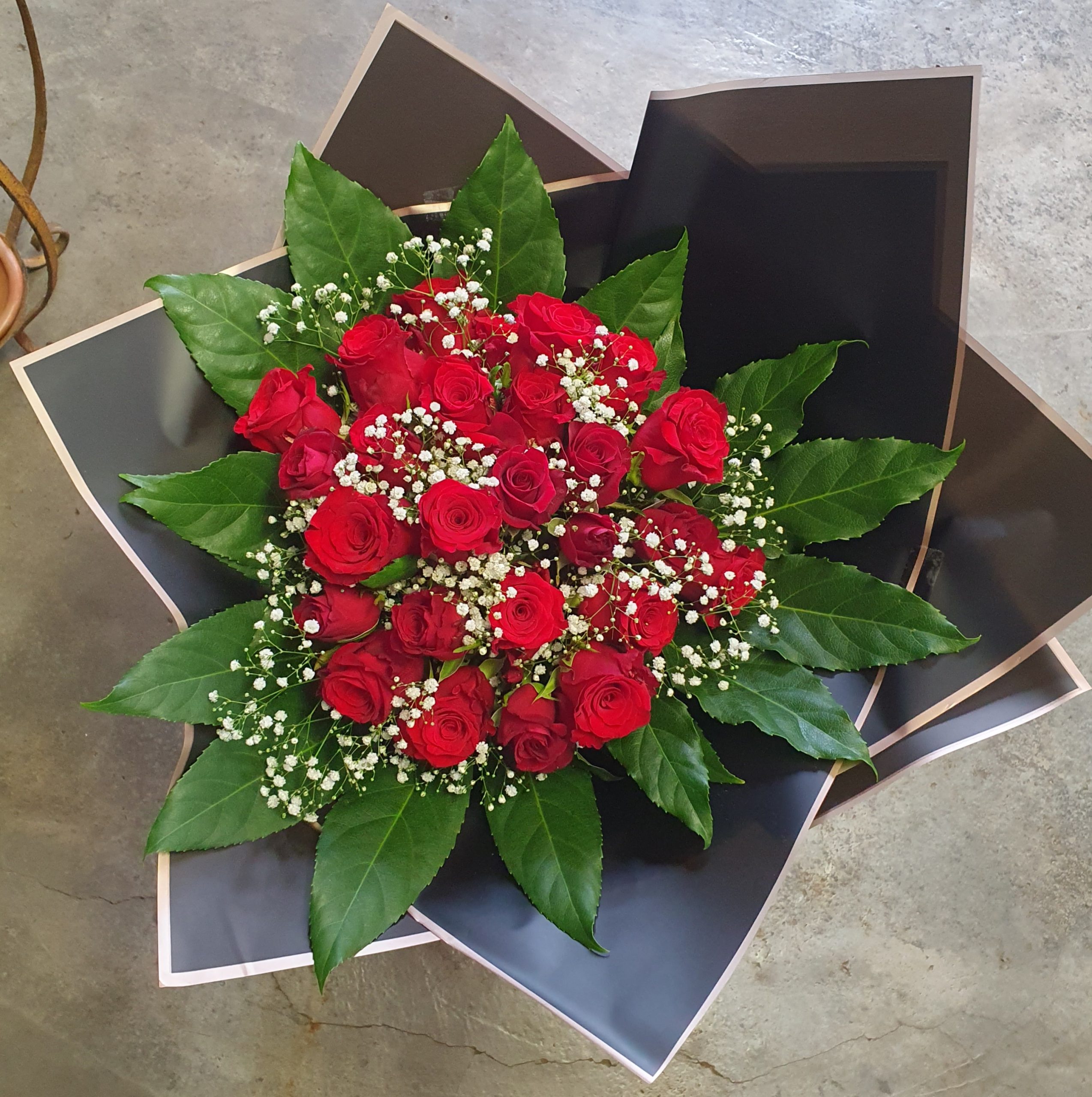 Red rose bunch in black paper – Order Flowers Online